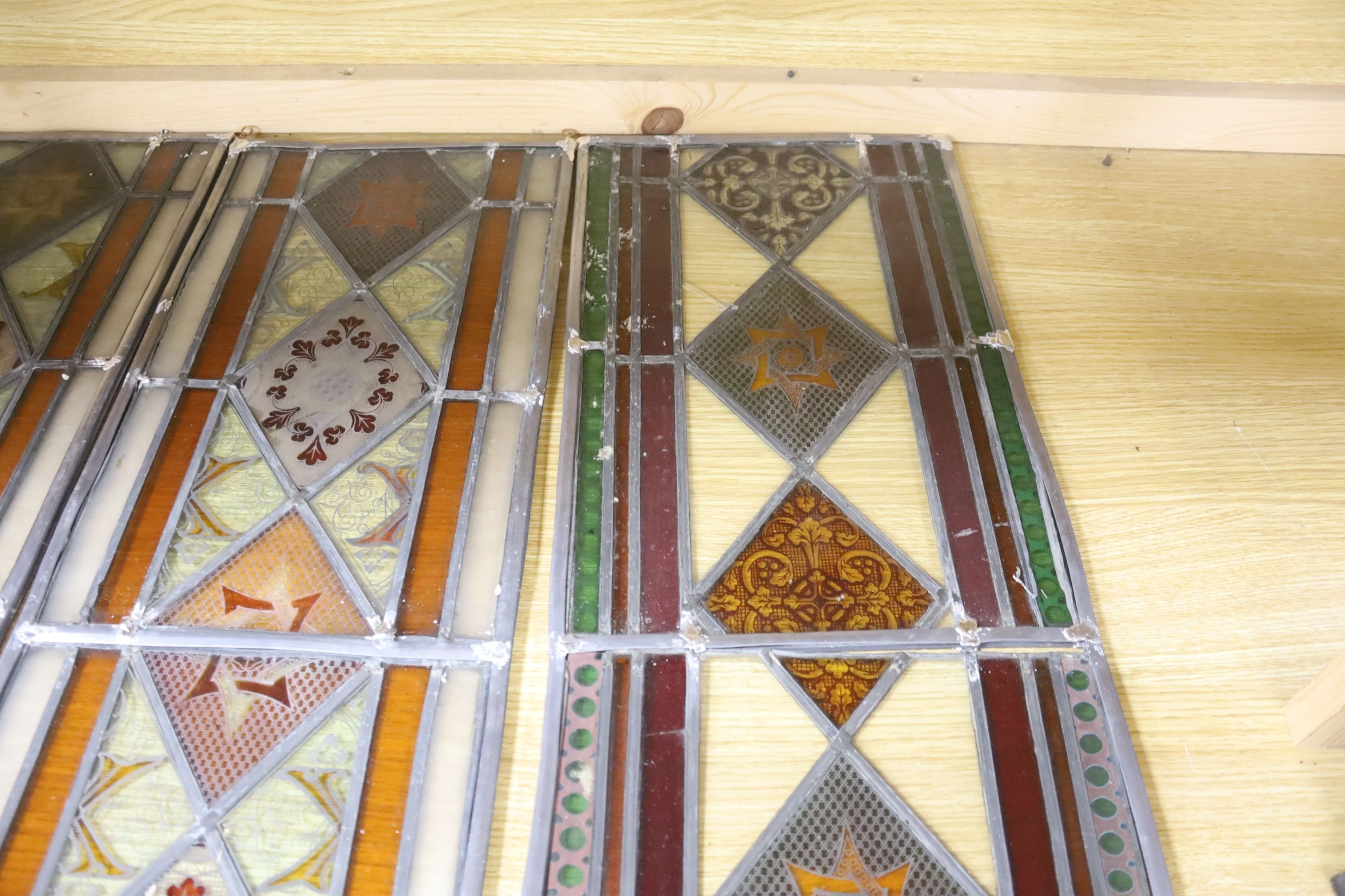 Four late 19th century stained and lead glass panels, 81 x 27cm